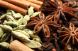 © New Africa - Mulled wine spices. Anise stars, cinnamon sticks, cardamon seeds and cloves as background, closeup