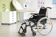 © Pixel-Shot - Empty wheelchair in physiotherapist's office