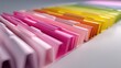 © 96 - Colorful Organized File Folders in Gradient Arrangement on Desk Surface