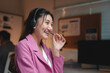 © crizzystudio - Smiling woman providing customer service with headset
