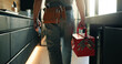 © Wess/peopleimages.com - Walking, tool box and back of man in home for maintenance, service or repair job in kitchen. Equipment, customer care and male contractor with plumbing career at client house for leak inspection.