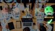 © InfiniteFlow - A diverse group of professionals collaborates in an office setting, analyzing data and reports to develop strategies for business improvement and growth. Raster