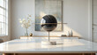 © Irvan - Modern decorative marble sphere on a table in a bright, minimalist room
