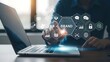 © Tanbir - Business professional analyzing digital brand strategy on laptop with futuristic technology icons in modern office environment