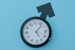 © izzuan - Clock on a blue background with a male gender symbol. Biological clock, aging, health issues, andropause, low testosterone concept.