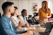© Jelena - Professional Team Engaged in a Collaborative Office Discussion