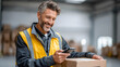 © Alex Alex - A warehouse worker in a yellow vest holds a box and uses a smartphone in front of a modern logistics center. The concept of delivery, logistics, and online tracking of parcels.