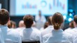 © Olga Ко - Medical Conference Audience: Doctors and Students Attending Professional Re-qualification Seminar and Knowledge Exchange Lecture in Modern Hospital Hall
