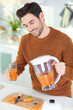 © auremar - young bearded man drinks freshly pressed natural juice