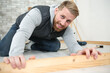 © auremar - man at home laying laminate flooring