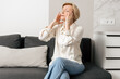 © brizmaker - Managing headache pain in a calm living room environment