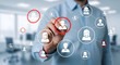 © Pixel Studio - Professional hand interacting with a digital network of connected user icons highlighting key personnel selection for human resources management strategy