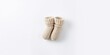 ©  AugmentArt - Knitted baby booties on white background, textile craftsmanship for newborn comfort