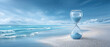 © javu - Serene beach hourglass stable financial future concept with calm sea and sky