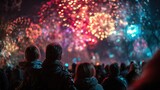 Diverse crowd observing a vibrant colorful fireworks display lighting up the night sky with bokeh effects