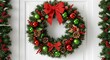© Edina - Festive Christmas wreath with ornaments and bow decorations, a symbol of holiday cheer