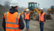 © lulla by - Construction workers with professional mood working on site with heavy machinery