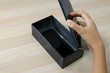 © kawa_xxx - Hand Opening New Smartphone Box