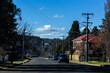 © Austockphoto - Cars driving along road from roundabout