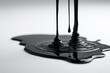 © Maryna - Glossy tarlike liquid drip with dramatic sheen on bare white background
