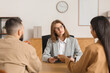 © Pixel-Shot - Female family mediator working with couple in office