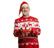 © opolja - Merry mature man wear red warm knitted sweater Santa hat posing hold present box with gift ribbon bow isolated on transparent background New Year 2026 holiday concept