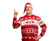© opolja - Merry mature man wear knitted christmas sweater Santa hat presenting something on transparent background. New year shopping idea concept. New Year 2026 Christmas