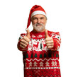 © opolja - Merry satisfied smiling mature man wear knitted christmas sweater Santa hat posing showing thumb up like gesture wink isolated on transparent background Happy New Year 2026 celebration holiday concept