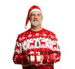 © opolja - Merry mature man wear red warm knitted sweater Santa hat posing hold present box with gift ribbon bow isolated on transparent background New Year 2026 holiday concept