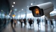 © Wandrian - Surveillance camera with a locked icon, monitoring a crowded indoor space