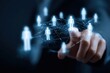 © WeeraWanderlust - Digital network concept with glowing human icons connected by lines over a person’s hand pointing forward.