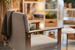 © Seventyfour - Empty armchair standing in nursing home interior with soft focus on background, suggesting waiting area or relaxation space for seniors, no people visible in scene