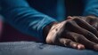 © Justlight - Focused shot of hands stretching and testing polymer blend material that autonomously repairs tears for longlasting durability in active wear