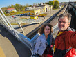 © Pavel Losevsky - Man and a woman are taking a selfie picture of themselves from a bridge near railroad station