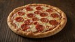 © Lasvu - Pepperoni pizza with cheese on a crust, placed on a wooden surface.