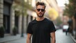 © rahwik - young male model wearing black t shirt on street in daylight showcasing casual outfit for shirt mockup template on hipster adult with natural pose concept of fashion retail branding
