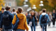 © Kateryna - Vibrant dynamic university campus during autumn faceless students walking chatting studying capturing academic life essence knowledge pursuit representation defocused seasonal