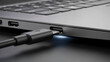 © Shanewaz - Close-up of a usb-c cable being plugged into a laptop