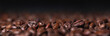 © kucherav - Roasted coffee beans macro with dark background