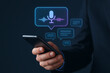 © aigiants - A hand holding a dark smartphone displaying a glowing, stylized microphone and sound wave graphic, indicating the use of voice assistant technology and real-time