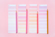 © Pixel-Shot - Composition with different paint color palettes and pencils on pink background