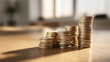 © Iori - 積み重ねられた硬貨が将来の資産形成と成長を表す金融イメージ