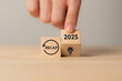 © Parradee - 2025 Recap economy, business, financial concept. Business planning in 2026. RECAP text on wooden blocks and hand flipping of 2025 to strategic planning and idea icon on wooden blocks.