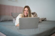 © Sergey Mironov - Playful Morning Browsing While Resting in Bed