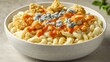 © ANASTASIIA - Premium mac bowl with buffalo cauliflower, blue cheese crumbles and hot sauce drizzle served in modern white speckled ceramic dish on concrete surface