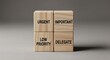 © QuiinL - Four wooden blocks arranged in a 2x2 grid, each labeled with a word related to task management: Urgent, Important, Low Priority, and Delegate.