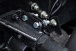 © NastyaPhoto - Fasteners and bolts on the car, bolts on the trailer, clips on the metal, parts and spare parts for trucks