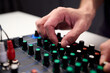 © Евгений Вершинин - Closeup of hands adjusting mixer with glowing LED indicators and cables, Detailed image of operator controlling mixer dials and monitoring sound through sensors and LEDs
