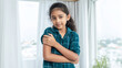 © Bonsales - Indian girl expressing happiness and confidence, embracing childhood in a domestic setting near a window