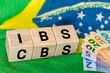 © Rochu_2008 - Brazil Finance and taxes. IBS and CBS written on a wooden block IBS. Concept, Brazilian tax reform, simplification of VAT in two local IBS fees for goods and services and the Federal CBS contribution.